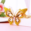 Colorful crystal butterfly keychain with yellow rhinestones and golden metal alloy finish - Yellow Gem Butterfly