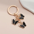 Gold-plated keychain with three black acrylic butterflies and sparkling rhinestones - Black