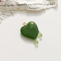 Detailed view of a translucent green melting heart charm with a golden metal loop - Grey Green