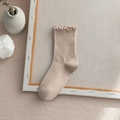 Beige mid-calf cotton socks featuring decorative ruffle edges in a cozy aesthetic setup - One Size / Khaki