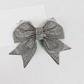 Close-up of sparkling white rhinestone bow hair clip with luxury crystal inlay design - 10cm Large Swallowtail Double Pointed White Rhinestone