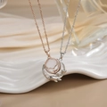 Close-up of rose gold and silver couple necklaces with micro-inlaid stones on silk - Gold Silver Cloud Whale Tail Magnetic XL0286GA