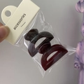 Detailed view of a dark reddish-brown jelly hair claw clip in a transparent gift bag - Small Semicircle (Dark Coffee + Wine Red)