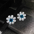 Flower-shaped silver stud earrings with square blue topaz and white pear-cut gems - Topaz Blue Stud Earrings