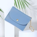 Minimalist light blue envelope card wallet with gold hardware on white display - Blue