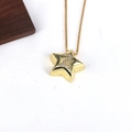 Detailed close-up of a gold star pendant featuring a shimmering letter Z zircon inlay - Letter Z