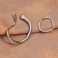 Minimalist silver geometric ear cuffs set with sleek streamlined and irregular ring designs - Ear Cuff (EL6005) / White Gold