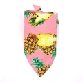 Detailed close-up of a pink cotton pet bandana with vibrant yellow pineapple print - S / Pink Pineapple