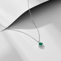 Elegant silver necklace with a square emerald zircon pendant on a clean white background - 925 Silver / White