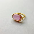 Close-up of 18K gold plated ring featuring a pink gemstone and clear zircon accent - US 6 / Light Pink