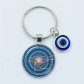 Blue Evil Eye keychain with Horus Eye pendant in silver metal finish for protection - Eye of Horus