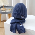 Close-up of knit beanie and scarf set featuring dog embroidery and ribbed texture - Dark Blue