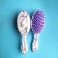 Set of two transparent dinosaur hairbrushes with purple bristles and colorful sequins - Purple Base Dinosaur Foam Style