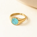 Detailed close-up of a gold signet ring featuring an inlaid round turquoise stone - Gold Round Turquoise Signet Style (KCJZ0082)