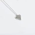 Elegant silver heart pendant necklace with textured 3D design on a delicate chain - Striped Heart (Silver)