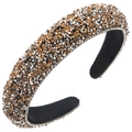 Macro shot of sparkling amber and silver rhinestone headband with wide padded design - Brown