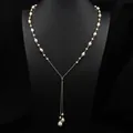 Long Y-shaped gold necklace featuring elegant freshwater pearls and textured charms - Baroque Pearl Wire Wrapped Sweater Chain