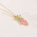 Chic pink zircon carrot pendant necklace with green leaf accents on gold chain - Carrot
