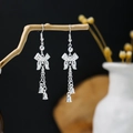 Silver bow-knot tassel earrings with bell charms in a bohemian vintage ethnic style - Bow Multi-layer Tassel Bell Style (E3801)