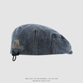 Detail of kids denim cap showing brown bear embroidery and adjustable elastic drawstring - 52cm (3-6 Years) / Dark Blue