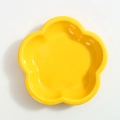 Yellow flower shaped ceramic cat bowl with glossy finish and wavy petal edges - Yellow