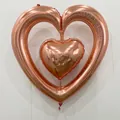 Detailed view of interconnected rose gold heart balloons with dimensions 98 x 102 cm - Heart-to-Heart / Rose Gold
