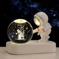 Astronaut night light featuring a 3D laser-engraved crystal ball on a sleek white base - Sphere / Rose Figure (Natural Light)