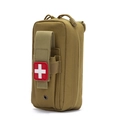 Macro detail of khaki nylon tactical medical pouch with MOLLE attachment and cross patch - Tan
