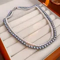 Elegante collana a due strati con perle grigie e bianche e chiusura in metallo argento - Stile a Doppio Strato / Bianco-Grigio