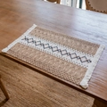 Bohemian woven place mat with geometric embroidery and white tassels in natural linen color - Brown Rhombus Grid