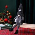Close-up of a handmade grey Christmas gnome plush with long legs holding a coffee cup. - Black Women's Style