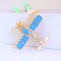 Golden fighter plane keychain with blue enamel wings and sparkling rhinestones - Blue Fighter Jet