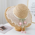 French straw hat with wide frayed brim featuring pearls, mesh, and tulip ribbon pendant - Pink