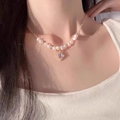 Elegant pearl necklace with purple gemstone pendant and gold chain on model - Glazed Dream Artificial Pearl Necklace (X3868B) / Purple