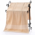 Light beige premium cotton bath towel with decorative honeycomb border on a black rack - Rice Grid Jacquard Bath Towel (Light Brown) / 70*140cm
