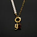 Stainless steel pearl necklace with Gothic letter Y and red gemstone pendant in gold - Gothic Letter Y