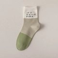 Three-tone color block crew socks in white, beige, and green with IT'S A GOOD WEEK slogan - Mastery Green