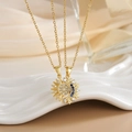 Detail showing gold sun and moon pendants with micro-paved zircons on elegant silk - Gold Sun Moon Blue White Zirconia Set XL0282A