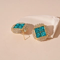 Detailed macro view of geometric earrings featuring blue crystals and white rhinestones - Silver Earring Post-Blue