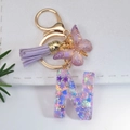 Letter N keychain with purple glitter snowflakes, golden butterfly and suede tassel charm - Letter N