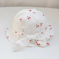 Cute white baby sun hat with red cherry print and a large decorative bow on top - 48cm (Recommended for 6-18 Months) / White