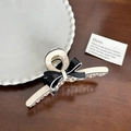 Elegant beige and black bow hair claw clip for women on a natural wooden background - White Base Ribbon Medium-11cm
