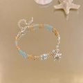 Dettaglio del bracciale di perle marine con ciondolo a stella marina e conchiglie - Stile Stella Marina Blu Marrone (Bracciale-Blu-Caffè-Stella Marina)