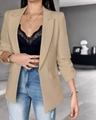 Detalle de blazer beige de manga larga con cuello de solapa y textura de tejido - S / Albaricoque