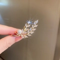 Close-up of golden leaf brooch with sparkling marquise zircons and a white round pearl - Gold Wheat Pearl Zircon Style (46#)