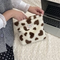 Detailed shot of plush heart leopard print makeup bag with woven brand label decoration - White With Brown Hearts