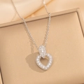 Close-up of a silver heart pendant necklace with micro-pave zircons in a gift box - Silver Necklace (8895)