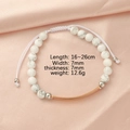 Detail of adjustable white marble bead bracelet with rose gold curved bar on pink silk - White Turquoise + Rose Gold Plate