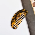 Cellulose acetate hair comb in a classic tortoiseshell finish with anti-static teeth - Dark Tortoise Oval