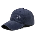 Dark blue washed cotton baseball cap with white sun embroidery and curved brim in side view - One Size / Navy Blue